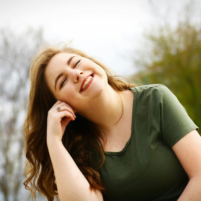 Smiling girl that just got teeth whitening done by Aspen Dental Care in SW Calgary