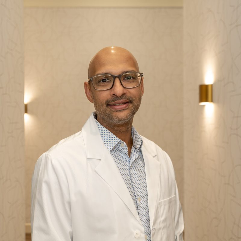 Dr. Ashish Oommen, dentist at Aspen Dental Care in SW Calgary